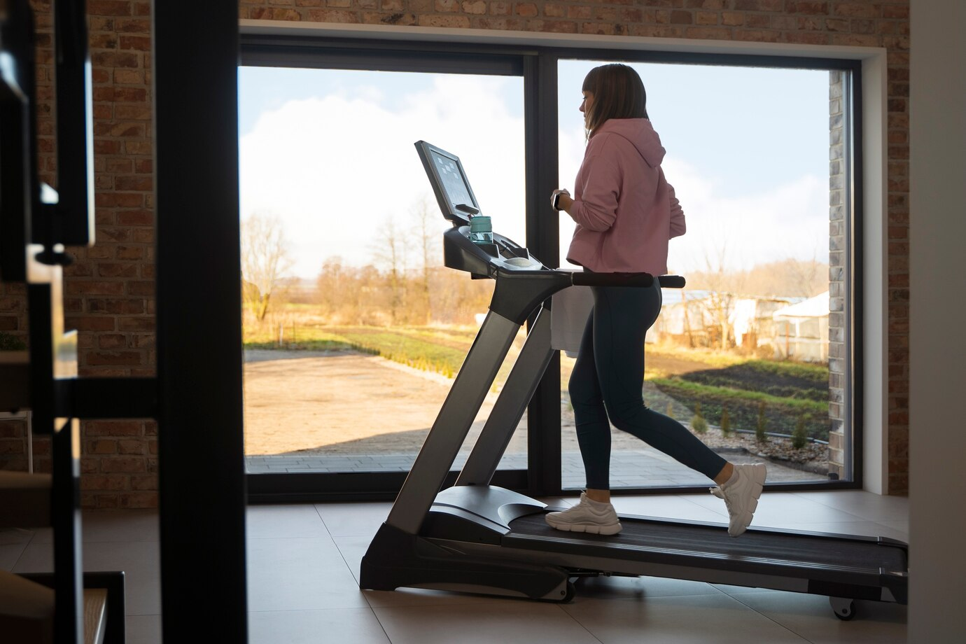 A woman is running on the treadmill